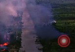 Image of Aerial bombing views of village in Vietnam war Vietnam, 1965, second 10 stock footage video 65675054848