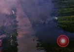 Image of Aerial bombing views of village in Vietnam war Vietnam, 1965, second 15 stock footage video 65675054848