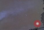 Image of huts attacked in bombing mission in Vietnam War Vietnam, 1965, second 21 stock footage video 65675054855