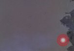 Image of huts attacked in bombing mission in Vietnam War Vietnam, 1965, second 22 stock footage video 65675054855