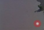 Image of huts attacked in bombing mission in Vietnam War Vietnam, 1965, second 23 stock footage video 65675054855