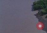 Image of huts attacked in bombing mission in Vietnam War Vietnam, 1965, second 24 stock footage video 65675054855
