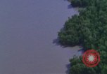 Image of huts attacked in bombing mission in Vietnam War Vietnam, 1965, second 25 stock footage video 65675054855