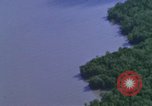 Image of huts attacked in bombing mission in Vietnam War Vietnam, 1965, second 26 stock footage video 65675054855