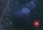 Image of huts attacked in bombing mission in Vietnam War Vietnam, 1965, second 46 stock footage video 65675054855
