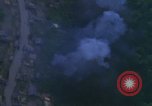 Image of huts attacked in bombing mission in Vietnam War Vietnam, 1965, second 47 stock footage video 65675054855