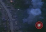 Image of huts attacked in bombing mission in Vietnam War Vietnam, 1965, second 50 stock footage video 65675054855
