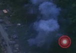 Image of huts attacked in bombing mission in Vietnam War Vietnam, 1965, second 51 stock footage video 65675054855