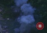 Image of huts attacked in bombing mission in Vietnam War Vietnam, 1965, second 52 stock footage video 65675054855