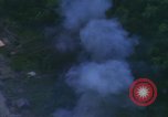 Image of huts attacked in bombing mission in Vietnam War Vietnam, 1965, second 53 stock footage video 65675054855