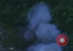 Image of huts attacked in bombing mission in Vietnam War Vietnam, 1965, second 55 stock footage video 65675054855