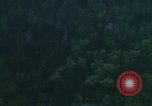 Image of huts attacked in bombing mission in Vietnam War Vietnam, 1965, second 57 stock footage video 65675054855