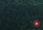 Image of huts attacked in bombing mission in Vietnam War Vietnam, 1965, second 58 stock footage video 65675054855