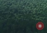 Image of huts attacked in bombing mission in Vietnam War Vietnam, 1965, second 59 stock footage video 65675054855