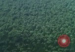 Image of huts attacked in bombing mission in Vietnam War Vietnam, 1965, second 60 stock footage video 65675054855