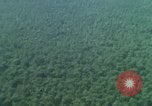 Image of huts attacked in bombing mission in Vietnam War Vietnam, 1965, second 61 stock footage video 65675054855