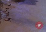 Image of A-1E aircraft dropping bombs Vietnam, 1965, second 14 stock footage video 65675054858