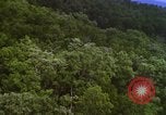 Image of A-1E aircraft dropping bombs Vietnam, 1965, second 25 stock footage video 65675054858
