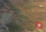 Standbild Luftbild des Viet Cong bombardiert Hütten Quang Duc Vietnam, 1965, aus Sekunde 8 historischem Filmmaterial Videoclip 65675054878