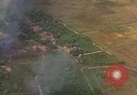 Standbild Luftbild des Viet Cong bombardiert Hütten Quang Duc Vietnam, 1965, aus Sekunde 12 historischem Filmmaterial Videoclip 65675054878