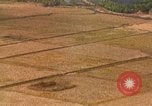 Standbild Luftbild des Viet Cong bombardiert Hütten Quang Duc Vietnam, 1965, aus Sekunde 44 historischem Filmmaterial Videoclip 65675054878