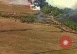 Standbild Luftbild des Viet Cong bombardiert Hütten Quang Duc Vietnam, 1965, aus Sekunde 49 historischem Filmmaterial Videoclip 65675054878