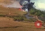 Standbild Luftbild des Viet Cong bombardiert Hütten Quang Duc Vietnam, 1965, aus Sekunde 51 historischem Filmmaterial Videoclip 65675054878