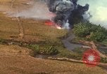 Standbild Luftbild des Viet Cong bombardiert Hütten Quang Duc Vietnam, 1965, aus Sekunde 52 historischem Filmmaterial Videoclip 65675054878