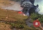 Standbild Luftbild des Viet Cong bombardiert Hütten Quang Duc Vietnam, 1965, aus Sekunde 53 historischem Filmmaterial Videoclip 65675054878