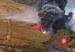 Standbild Luftbild des Viet Cong bombardiert Hütten Quang Duc Vietnam, 1965, aus Sekunde 54 historischem Filmmaterial Videoclip 65675054878
