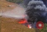 Standbild Luftbild des Viet Cong bombardiert Hütten Quang Duc Vietnam, 1965, aus Sekunde 56 historischem Filmmaterial Videoclip 65675054878