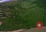 Image of Viet Cong huts bombed Vietnam, 1965, second 33 stock footage video 65675054888