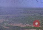 Image of bombardment of Viet Cong huts Vietnam, 1965, second 1 stock footage video 65675054890