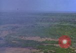 Image of bombardment of Viet Cong huts Vietnam, 1965, second 3 stock footage video 65675054890
