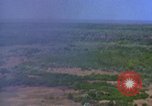 Image of bombardment of Viet Cong huts Vietnam, 1965, second 4 stock footage video 65675054890