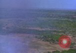Image of bombardment of Viet Cong huts Vietnam, 1965, second 7 stock footage video 65675054890
