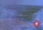Image of bombardment of Viet Cong huts Vietnam, 1965, second 8 stock footage video 65675054890