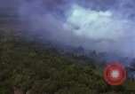 Image of bombardment of Viet Cong huts Vietnam, 1965, second 24 stock footage video 65675054890