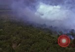 Image of bombardment of Viet Cong huts Vietnam, 1965, second 25 stock footage video 65675054890