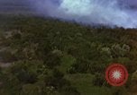 Image of bombardment of Viet Cong huts Vietnam, 1965, second 34 stock footage video 65675054890