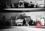 Image of Mother Katherine Larke miniature doll house San Francisco California USA, 1930, second 33 stock footage video 65675054984