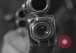 Immagine di Combinazione di revolver movie camera United States USA, 1935, secondo 4 filmato di repertorio 65675055177