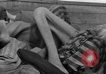Image of dead bodies Dachau Germany, 1945, second 51 stock footage video 65675055238
