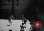 Image of basketball court on aircraft carrier hangar deck Pacific Ocean, 1945, second 1 stock footage video 65675055308