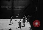 Image of basketball court on aircraft carrier hangar deck Pacific Ocean, 1945, second 4 stock footage video 65675055308