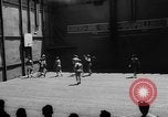 Image of basketball court on aircraft carrier hangar deck Pacific Ocean, 1945, second 15 stock footage video 65675055308