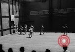 Image of basketball court on aircraft carrier hangar deck Pacific Ocean, 1945, second 17 stock footage video 65675055308