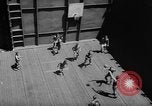 Image of basketball court on aircraft carrier hangar deck Pacific Ocean, 1945, second 19 stock footage video 65675055308