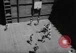 Image of basketball court on aircraft carrier hangar deck Pacific Ocean, 1945, second 20 stock footage video 65675055308