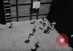 Image of basketball court on aircraft carrier hangar deck Pacific Ocean, 1945, second 21 stock footage video 65675055308